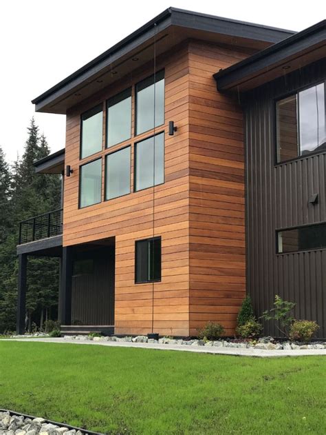 black metal siding house light wood|painted siding that looks like wood.